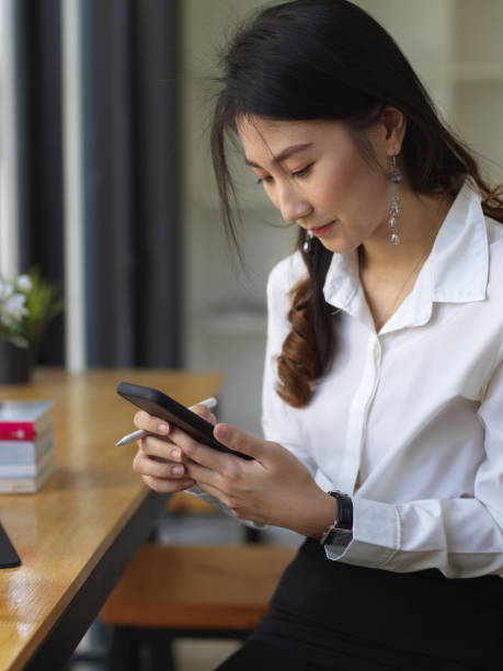 istock Female student take a break and relaxing with smartphone while doing homework 1281369156