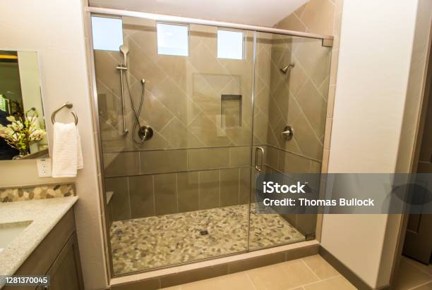 Bathroom Glass Shower With Door Tile Two Shower Heads Stock Photo - Download Image Now