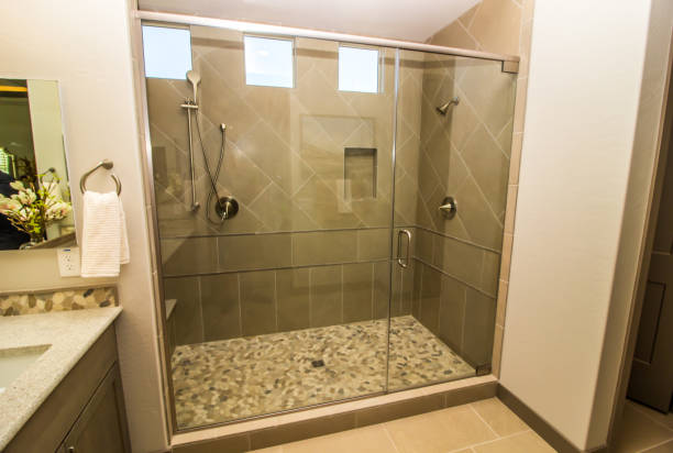 bathroom glass shower with door, tile & two shower heads - enclosure imagens e fotografias de stock