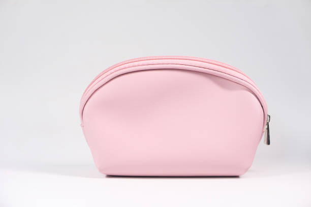 istock pink color women purse on white background 1281372005