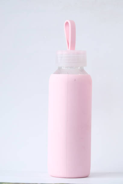 istock Close up of pink water bottle on table 1281372288