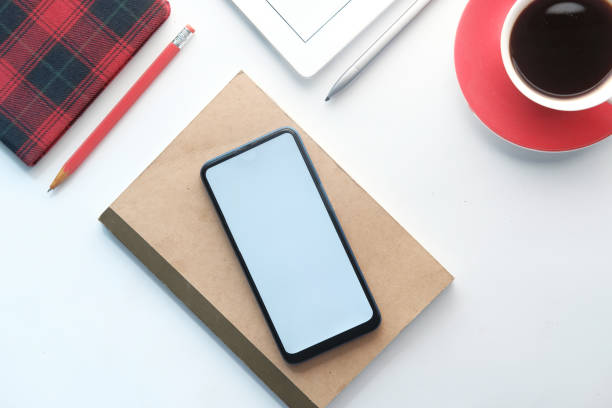 istock top view of smart phone and notepad on table 1281373040