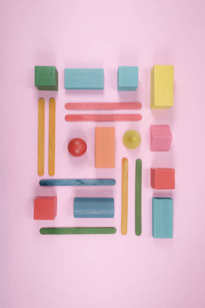 istock Minimalist composition of geometrical shapes on flat surface. Different shapes with different colors. Kids wooden toys. 1281377141