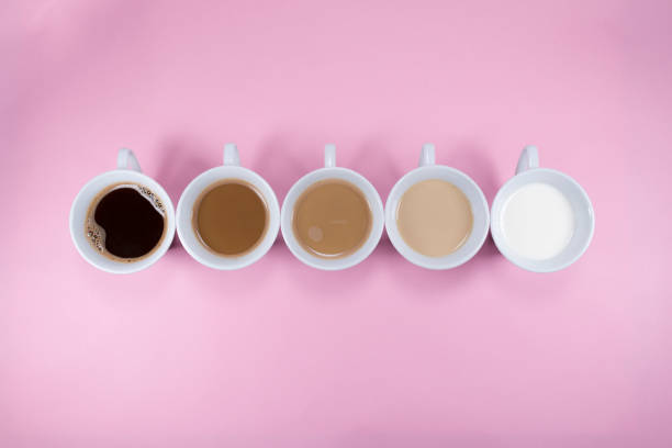 istock Five cups of coffee on pink background 1281377435
