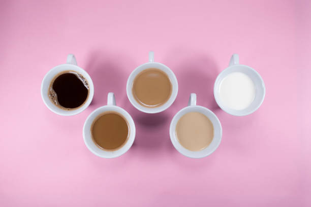 istock Five cups of coffee on pink background 1281377615