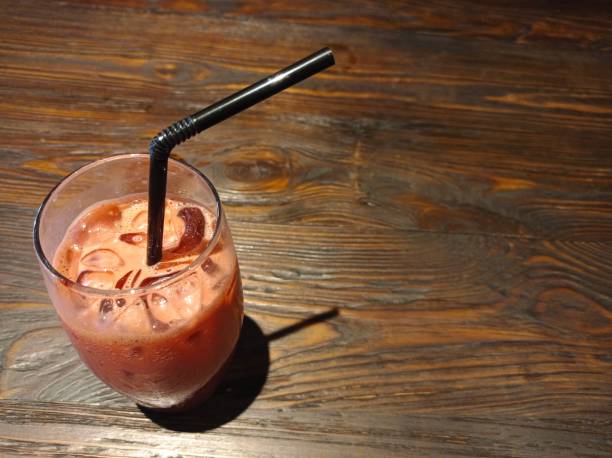 istock red ice drink on wooden textured background 1281380651
