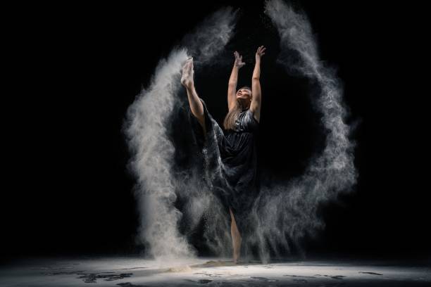 istock Graceful lady in underwear dancing with dust 1281382925