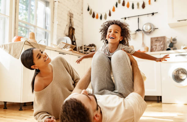 istock Happy multiracial family playing in kitchen 1281384516