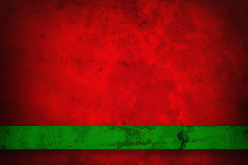 Fancy red Christmas background with old vintage grunge texture and green ribbon stripe on border with blank copyspace to add your own text or image