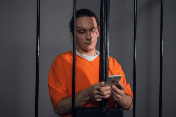 istock A dangerous criminal with tattoos on his face in prison got a smartphone to commit cyber crimes over the Internet 1281387878