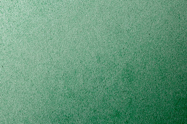 istock Abstract background with green texture, velvet fabric, close-up. Colorful felt texture for background with copy space. Felt fabric sheet 1281388546