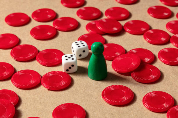 istock Board games concept. Red pieces, dice, and a pawn 1281388724