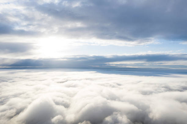 istock Aerial view white clouds in blue sky. View from drone. Aerial view cloudscape texture background. Texture of clouds. View from above. Panorama clouds background 1281389476