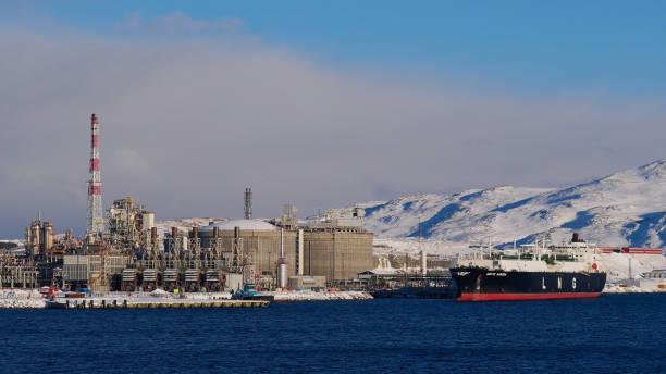 Closeup view of tanker anchoring at Europe's largest liquefied natural gas (LNG) site on Melkøya island in the arctic sea in winter time. stock photo