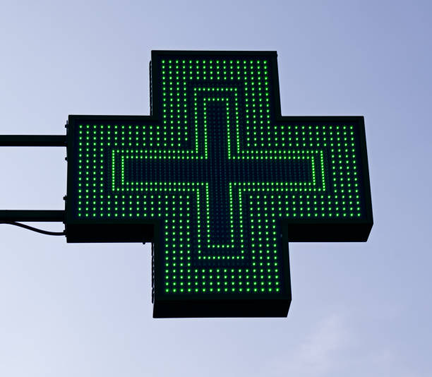 Green cross pharmacy sign. European pharmacy store. Green cross pharmacy sign. European pharmacy store. farmacia stock pictures, royalty-free photos & images