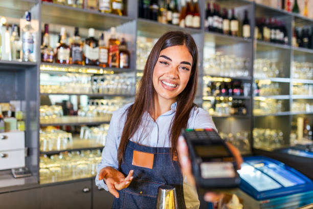 istock Contactless payment concept, female holding terminal nfc technology on counter, client make transaction pay bill on terminal rfid cashier machine in restaurant store, close up view 1281393437