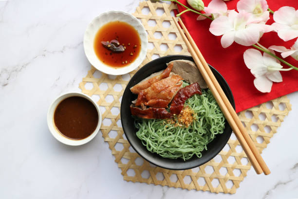 roasted duck noodles on white marble background, thai-chinese food called mee yok ped yang - top view copy space - ped imagens e fotografias de stock