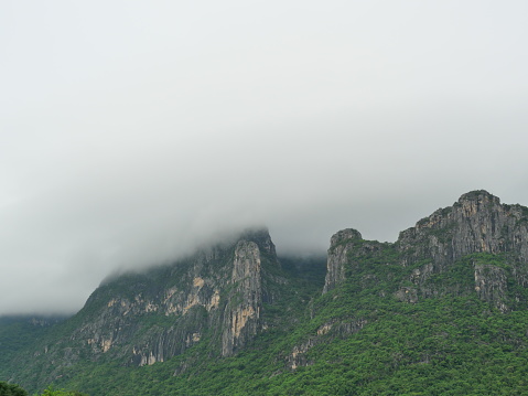 Scenic view of mountains covered in fog