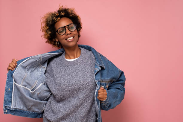 istock African young curly woman in jeans dancin 1281395542