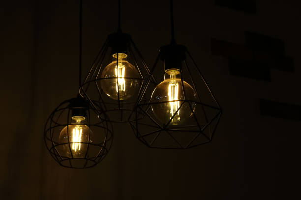 istock Retro style lamps on brick wall background 1281395753