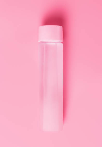 istock Water bottle on pink background copy space, top view 1281395899