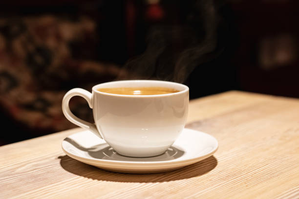 istock Cup with aromatic coffee on a wooden table 1281396605