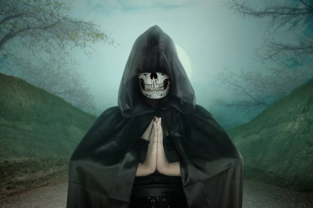 Asian witch woman with cloak standing with night scene background