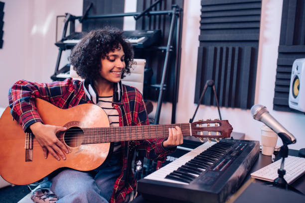 istock Happy girl making music at her studio 1281397800