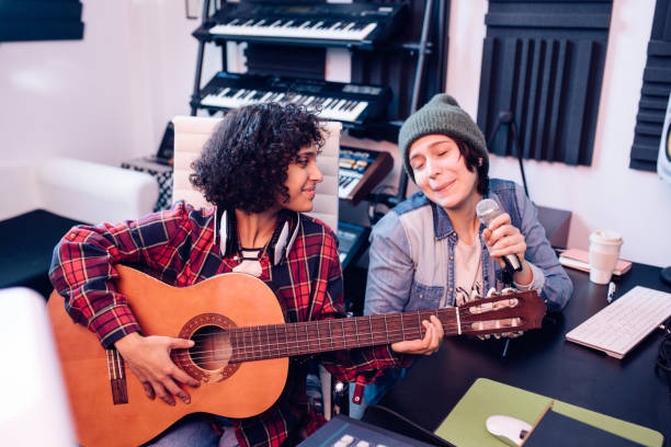 istock Two musicians composing a song together 1281397858