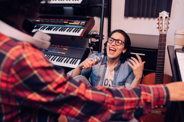 istock Two musicians on a recording session in the music studio 1281397875
