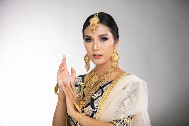 Indian beautiful bridal woman wear Traditional wedding dress costume Indian beauty eyes with perfect make up wedding bride, Portrait of a beautiful woman in traditional ethnic Pakistani bridal costume with heavy jewellery, gray background banner copy space beautiful traditional indian girl stock pictures, royalty-free photos & images