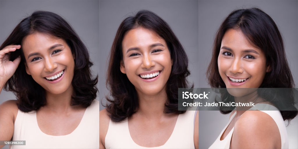 Fashion Portrait Profile Asian Woman fashionable item make up Portrait of Fashion 20s Asian Woman has beautiful face, she wear white shirt, smile happy feeling with white teeth over gray Background isolated Indian Ethnicity Stock Photo
