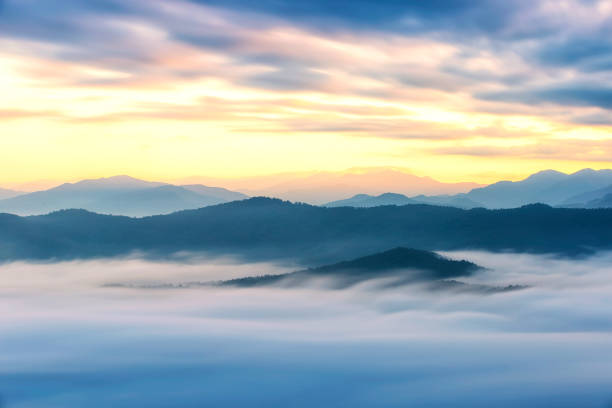 istock Mountain with fog at sunrise 1281399073