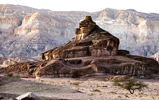 View on the arid mountain in triangle shape in Timna park located in Negev desert in Israel.