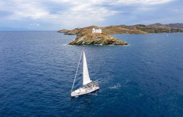 istock Sailing boat with white sails, rippled sea background 1281404022
