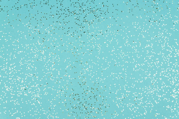 istock Blue Festive background texture with glittering silver confetti 1281404398