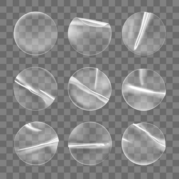 istock Transparent round adhesive stickers mock up set isolated on transparent background. Plastic crumpled round sticky label with glued effect. Template of a label or price tags. 3d realistic vector mockup 1281406523