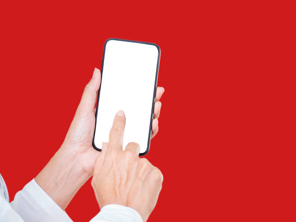 istock Hand Of Woman Touching Smartphone On Red Background 1281406873