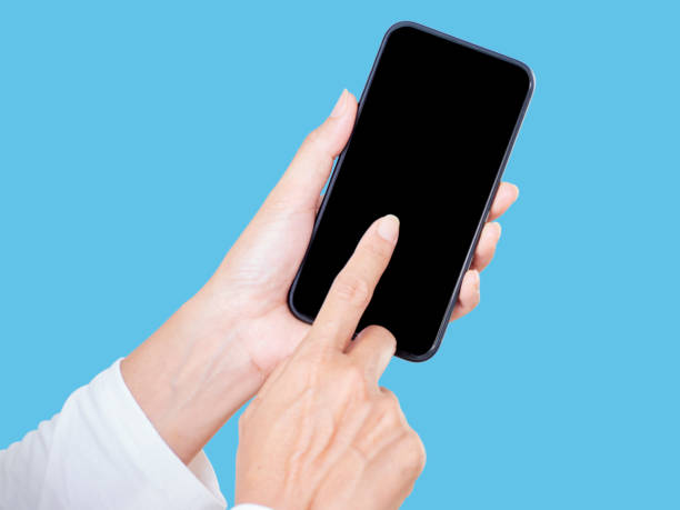 istock Hand Of Woman Touching Smartphone On Blue Background 1281406880