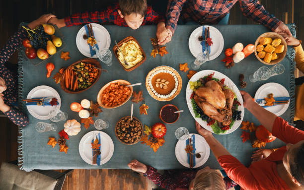 istock Family Having Traditional Holiday Stuffed Turkey Dinner 1281409340