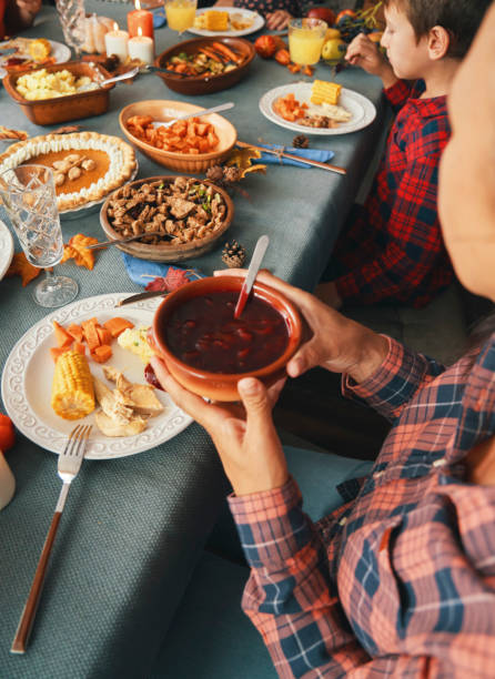 istock Family Having Traditional Holiday Stuffed Turkey Dinner 1281409415