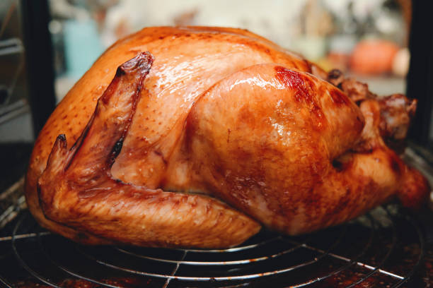 istock Roasting Turkey in the Oven for Holiday Dinner 1281409633