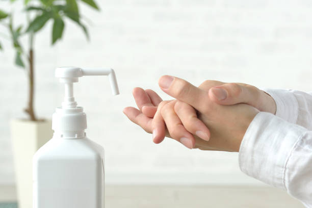 istock Human's hands disinfecting with alcohol spray 1281409819