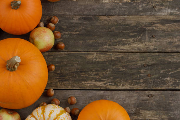 istock Wood background with pumpkin 1281410795