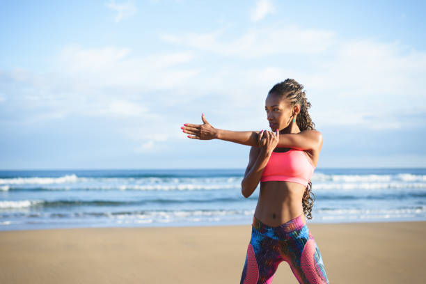 istock Fitness stretching exercise at the beach 1281412094