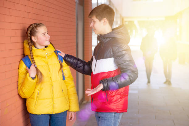 istock Young high school students chatting on the street 1281412262