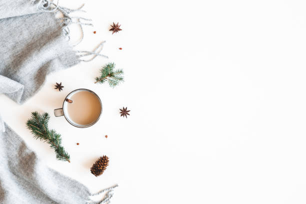 istock Christmas composition. Cup of coffee, fir tree branches, plaid on white background. Christmas, winter, new year concept. Flat lay, top view 1281413418