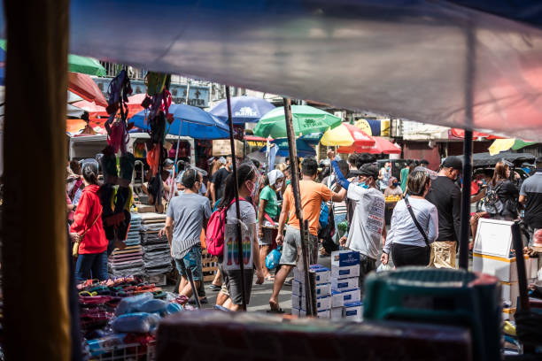 Divisoria, Manila, Philippines - A bustling scene at the street market, as seen from inside a stall. Divisoria, Manila, Philippines - Oct 2020: A bustling scene at the street market, as seen from inside a stall. divisoria market stock pictures, royalty-free photos & images