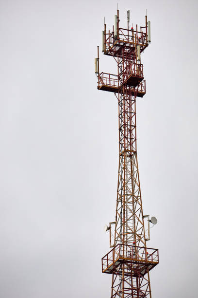 istock Telecommunications Cell Phone tower with mobile antennas on blue sky background. 1281413997