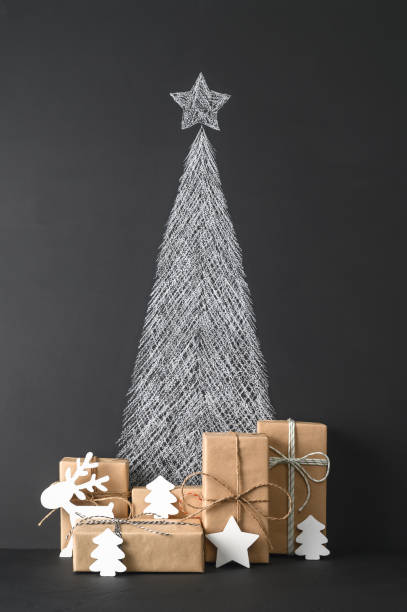 istock Creative Alternative Christmas tree. Christmas background with chalkboard and presents. 1281415293
